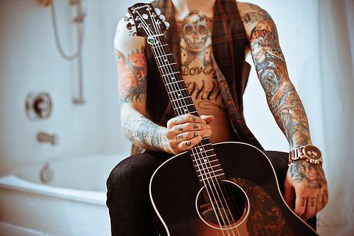 Tagged guitar Tattoo Man