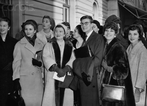 Yves Saint Laurent with models at Victoria station, London, 1958