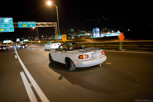 Stanced mazda miata driving on Montreal roads at night