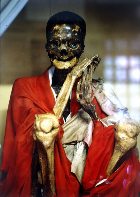 Sokushinbutsu - Buddhist ritualistic self-mummification
For 1,000 days (a little less than three years) the priests would eat a special diet consisting only of nuts and seeds, while taking part in a regimen of rigorous physical activity that stripped them of their body fat. They then ate only bark and roots for another thousand days and began drinking a poisonous tea made from the sap of the Urushi tree, normally used to lacquer bowls. This caused vomiting and a rapid loss of bodily fluids, and most importantly, it made the body too poisonous to be eaten by maggots. Finally, a self-mummifying monk would lock himself in a stone tomb barely larger than his body, where he would not move from the lotus position. His only connection to the outside world was an air tube and a bell. Each day he rang a bell to let those outside know that he was still alive. 