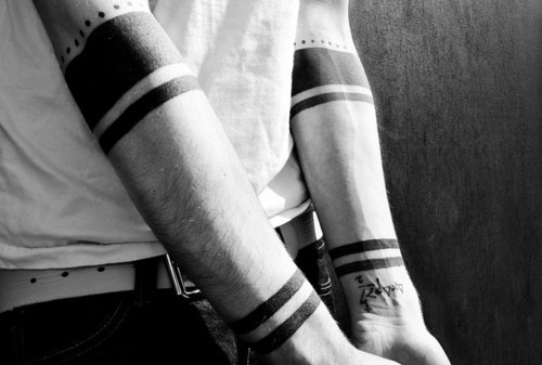Black armband tattoos are beautiful to me. They’re simple but bold ...