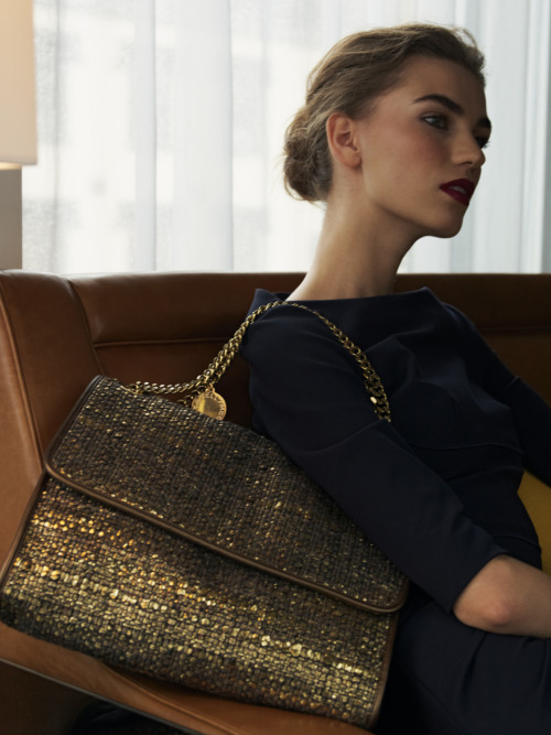 neimanmarcus:Stella McCartney’s metallic tweed handbag is oh so chic.  We also adore the bold brow and Bordeaux lip.