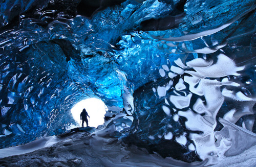 Icelandic Blue Glacier Ice Cave
This breathtaking picture by Örvar Atli was featured by one of my favorite blogs, My Modern Met. Örvar and his friend Skarpi have been busy capturing unique photos of Iceland from a mountaineer&#8217;s perspective. Their photos from inside this ice cave are a perfect example. You might also want to check out Skarpi&#8217;s photo from the ice cave.
I&#8217;ve worked a lot on glaciers and I can tell you that the caves are truly this amazing. The crystal clear blue ice is like nothing else. However, I&#8217;m glad to quote Örvar when he says: &#8220;Because of a recent accident in Iceland where a young amateur photographer died on a glacier I will not give details of this caves location. If you want to visit this place contact a local mountain guide.&#8221; There have been three perfectly avoidable glacier accidents in Iceland this year. Two of these had to do with glacier ice caves such as these and third happened on a glacier. With local knowledge and a mountain guide from fx. Icelandic Mountain Guides or Öræfaferðir, these accidents could have been avoided. The fact is that ice caves regularly collapse and glacier travel requires special skills.
For a few other ice cave photos, check out this ice cave which collapsed, this hypnotizingly blue ice tunnel and this ice cave large enough to park your truck in. Also you might check out Skarpi&#8217;s Professional photo page and Örvar&#8217;s Arctic Photos.