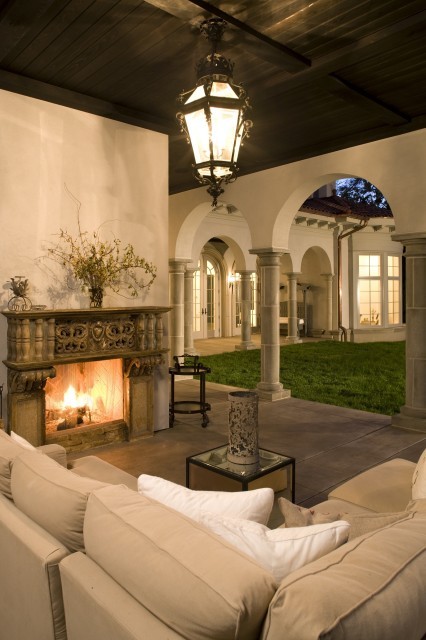 A magnificent Mediterraneanstyle covered loggia with stone columns and 