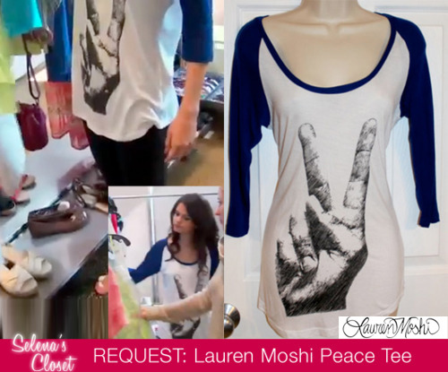We got a request for this peace sign tee Selena was wearing in the video of her Dream Out Loud photo shoot.
It is a Lauren Moshi Frankie Peace Sign Baseball Tee and is available in blue/white and pink/white. Unfortunately the blue tee is sold out however we found a size XS on Ebay for $118 - click here.
Otherwise, the pink tee is in stock at Revolve Clothing for $118. Buy it HERE.