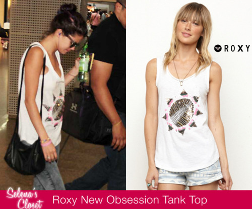 Selena was spotted in the Sao Paolo airport in Brazil yesterday wearing this Roxy New Obsession Tank Top. You girls are in luck because its currently on sale for $19.75!!
Get it HERE  
She&#8217;s also wearing her Alternative Apparel Dakota bag that we posted here
