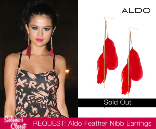 We got a request for the red feather earrings Selena was wearing in her music video for Hit The Lights. The exact earrings Selena was wearing are &#8220;Nibbs&#8221; from Aldo Shoes, however they are unfortunately sold out. We did find a similar pair of red feather earrings on sale for $10.00.
Buy them HERE.