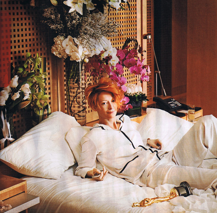 Tilda Swinton, the afternoon after winning her Oscar, February 25th 2008
Operating on just 30 minutes of sleep, Swinton was clearheaded enough to help direct a photo shoot in her suite at the Raffles L’Ermitage Beverly Hills. “Don’t you think Oscar should be more… lounging around?” she asked as she grabbed her statue off the nightstand and placed it beside her in bed. With the smell of Thai takeout permeating her room, Swinton giddily reflected on her victory lap the night before. After celebrating with her Michael Clayton costar George Clooney at the Sunset Tower Hotel, she headed to Prince’s house party. “Stevie Wonder sang ‘Superstition,’ for God’s sake,” she gushed. “It was absolutely fantastic.”