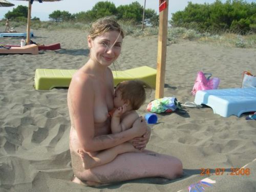 Nursing child on nude beach.
