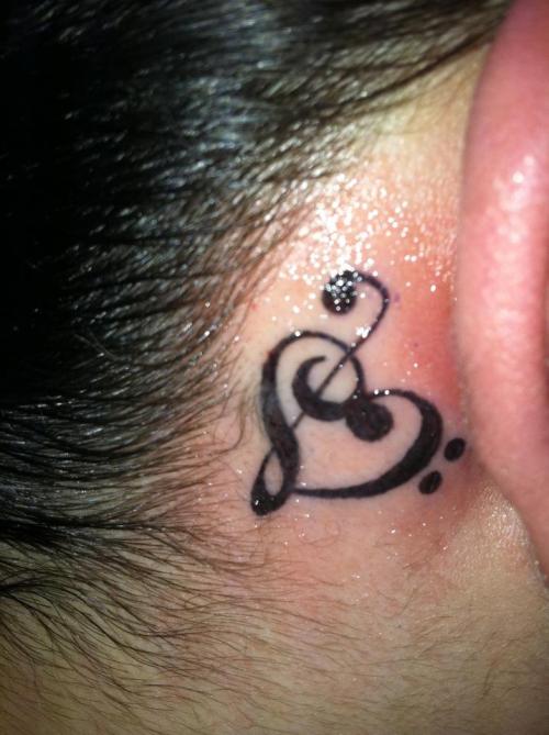 Nd tattoo is a heart infused with a music note tucked behind my ear its