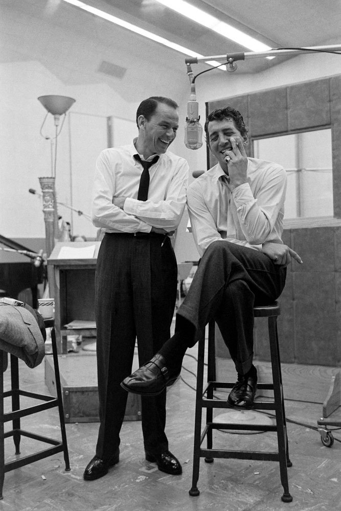life:

Frank Sinatra and Dean Martin share a light moment during their recording sessions for Sleep Warm in 1958. (Allan Grant—Time & Life Pictures/Getty Images)
See more photos here. 
