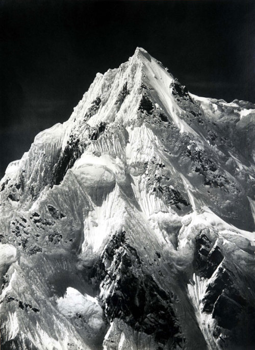 itwonlast:

Regarded as one of the finest mountain photographer ever, Vittorio Sella travelled the world to immortalize on film peaks and mounts that for the most part hadn’t been previously recorded. The aesthetic quality of his photographs prompted Ansel Adams to comment “the vastness of the subjects and the purity of Sella’s interpretations move the spectator to a definitely religious awe. In Sella’s photographs there is no faked grandeur; rather there is understatement, caution, and truthful purpose… Sella has brought to us not only the facts and forms of far-off splendours of the world, but the essence of experience which finds a spiritual response in the inner recesses of our mind and heart.”
While the photographs are a testament to Sella’s eye, they are also an indication of his dedication and climber skills: perfection came at a price that Sella was willing to pay by lugging around his fragile forty pounds Dallmeyer camera, two pounds glass plates — for which he had to invent carrying equipment, including modified pack saddles and rucksacks — and a portable photo lab (he had jars full of collodium to coat the plates and buckets full of developing solution as well as a tent to serve as his travelling darkroom). 
