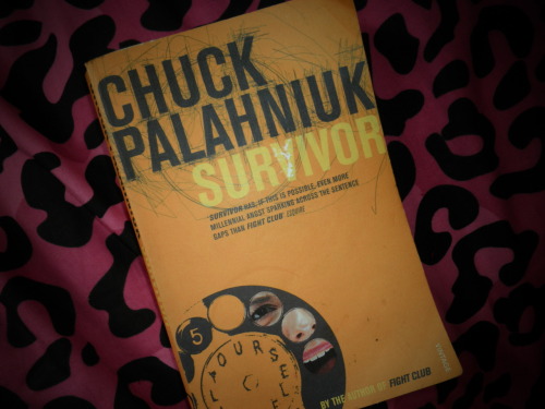 I read Chuck Palahniuk’s ‘Survivor’ on buses, in bars, in the bed of someone amazing, and lying in the grass absorbing beautiful sunshine. I finished Chuck Palahniuk’s ‘Survivor’ sitting on my bed alone, drinking cider, listening to the rain hit my window – and in this moment, I realised that no-one truly gets out of here alive.
‘Survivor’, without giving too much away, is the story of Creedish-cult-survivor-turned-pop-culture-messiah Tender Branson, his psychic quasi-girlfriend Fertility; and his twin brother, Adam Branson. Together without Tender’s knowledge, the three propagate a plan to save the world, resulting in mass murder and a plane spiralling out of control in the Australian desert, leaving behind the truth, but no survivors.
Palahniuk’s writing is hilariously dark, witty at times and tear-inducing at others, but above all else, it’s brutally honest. Why present hope for the future when you don’t see it? Many modern novels reject the idea of dystopic society in order to cultivate optimism within their readers; Palahniuk does no such thing.
The true nature of people, pack mentality and painful realism is explored using the upended concept of The One Who Lived, a recurring theme within literature throughout the ages – Palahniuk’s twist is to question whether the Survivor truly Survives, or if instead the horrors haunt forever.
After all, we all end up in the ground (or with our ashes recklessly spilled on the ground at airports, of course) when we’re done with it all. None of us make it out kicking, so who’s to say if the fight was ever worth it?