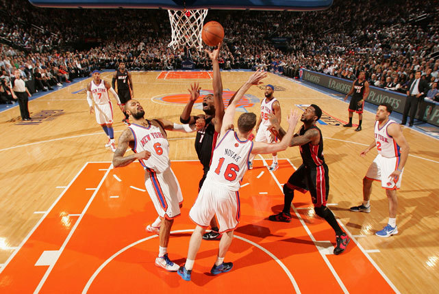 Chris Bosh gets off a shot in traffic during last night&#8217;s Heat-Knicks game. Miami took a commanding 3-0 series lead with an 87-80 victory. Bosh, who became a father earlier in the day, scored nine points and grabbed 10 rebounds for the Heat. (Nathaniel S. Butler/NBAE via Getty Images)
WERTHEIM: Future murky for Knicks after Game 3 loss LOWE: Sorry Knicks but the Heat&#8217;s offense is on a tear
