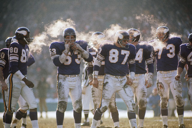 Members of the Minnesota Vikings offense &#8212; John Henderson (80), Jim Vellone (63), John Beasley (87), Gene Washington (84), and Ron Yary (73) &#8212; try and stay warm during the 1969 NFL Championship game against the Cleveland Browns. The Vikings would go onto win 27-7 to capture the NFL title before losing to the Chiefs in Super Bowl IV. This was the last Super Bowl before the NFL-AFL merger. (Neil Leifer/SI)
SI VAULT: Vikings roll past Browns and advance to Super Bowl (1.26.70)