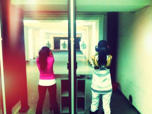 
 Selena Gomez with Priscilla DeLeon in a indoor shooting range for a firearms practice 