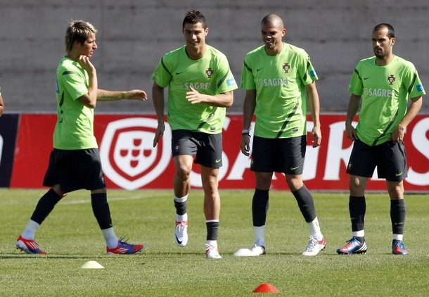  The Madridistas and Ruben Micael warming up.
Training 24.05.2012 (via Photo from Reuters Pictures)