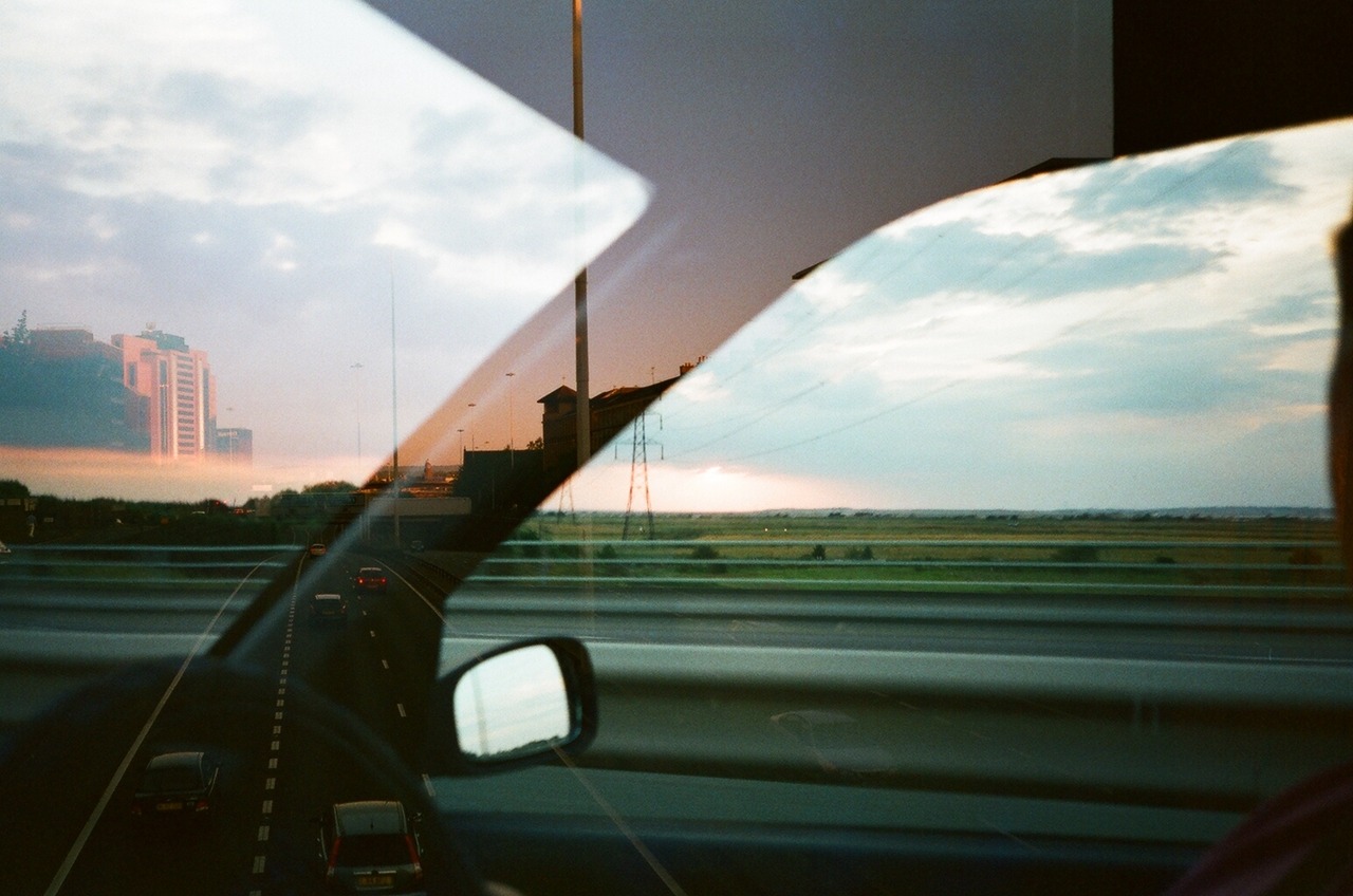 
starrcharmm:


Last week I shot a roll of film that I’d got free with a second hand camera. When I got back the scans I found out that the roll had already been used by the guy who gave me it and so I had double exposed it. By chance, both of us had taken a photo of a motorway landscape and this was made. His photo is from the inside of the car looking at countryside and my shot of an urban motorway is best seen on the left hand side. 


