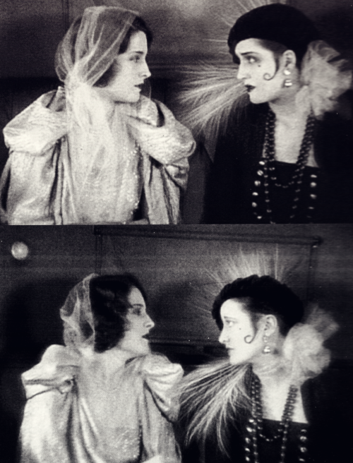 bobertsbobgomery:

Norma Shearer and double Joan Crawford in Lady of the Night, 1925
In Two Worlds, a story by Adela Rogers St. Johns, Norma Shearer essayed a dual-role. Florence (at left) is the well-bred graduate of a finishing school. Molly (at right) is a reform school graduate.  For over-the-shoulder shots  director Monta Bell used the newly-arrived Lucille LeSeur, who was later known as Joan Crawford. ‘My first appearance in front of the moving camera was anonymous,’ wrote Crawford in 1959. ‘While Norma played the Tough Girl (full-front, close-up) I played the Lady (with my back to the camera).’ Shearer was smart enough to recognize Crawford’s talent, raw though it may have been. ‘I found myself sitting in a car,’ she remembered, ‘and in the other corner was a girl with the most beautiful eyes. They were the biggest eyes I had ever seen. But they didn’t trust me. I could see that. They never have.’
-Hollywood Dreams Made Real: Irving Thalberg and the Rise of MGM
