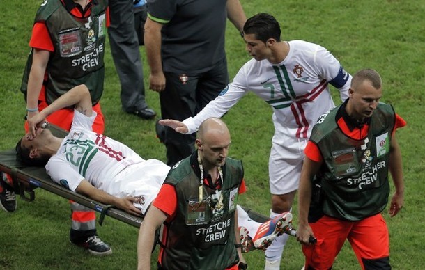 The captain caring for his injured team-mate.
EURO 2012&#160;1/4 final Portugal vs. Czech Republic, 21.06.2012. Half-time 0:0(via Photo from AP Photo)