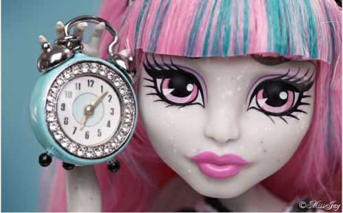 The eternal clock is ticking closer and closer to the first day of school and MH new ghoul, Rochelle, is ever so eager to get a head start on all the MH madness. 

“I miss some of the rock solid friendships I made last semester at Monster High,” the ghoul reported to the MHGG. “I simply cannot wait to immerse myself back into the open culture and monster legacy of this esteemed establishment.” 

Luckily for Rochelle, student bodies will be haunting the halls in just a few short weeks. Until then, the scary-sweet ghoul will be counting down the minutes until the clock strikes midnight and her nightmares are answered.