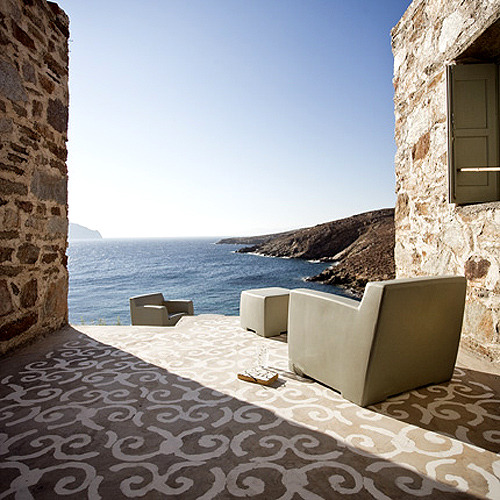 This glorious July weather has turned our thoughts towards light and sunshine, and we found inspiration in the Greek holiday home of Italian designer Paola Navone. Overlooking the Aegean, we love the elegant simplicity of the airy white theme throughout the house. The &#8216;carpets&#8217; are painted in white directly onto the concrete floors and look amazing.