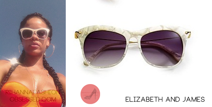 
Rihanna posted a picture on her instagram wearing $185.00   white framed sunglasses by  Elizabeth &amp; James; she is also seen wearing a $199 strapless orange bikini top  by  Prism.
