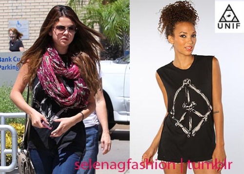 Selena stepped out for some lunch at panera bread with her grandparents keeping it casual in this UNIF The Peace Bones Top, this shirt can be found on karmaloop.com for $62! Buy it HERE!She paired this cute and casual look with DOL sunglasses and a Tolani scarf!