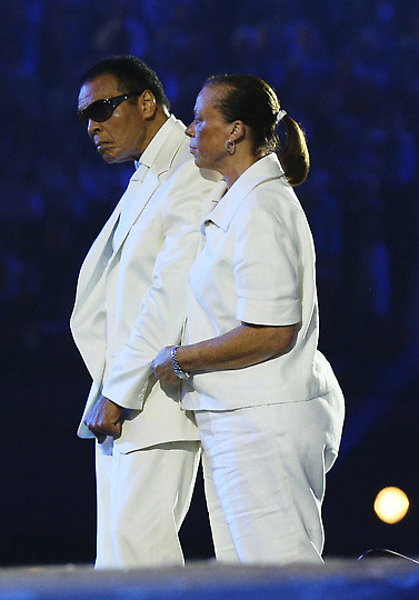 Boxer Muhammad Ali, left, and his wife, Yolonda Williams, participate in the Opening Ceremony at the 2012 Summer Olympics, Saturday, July 28, 2012, in London. (AP Photo/Cameron Spencer, Pool)