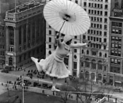hadesworld:

Crazy woman dances on a tightrope 300ft high with no harness, 1931
