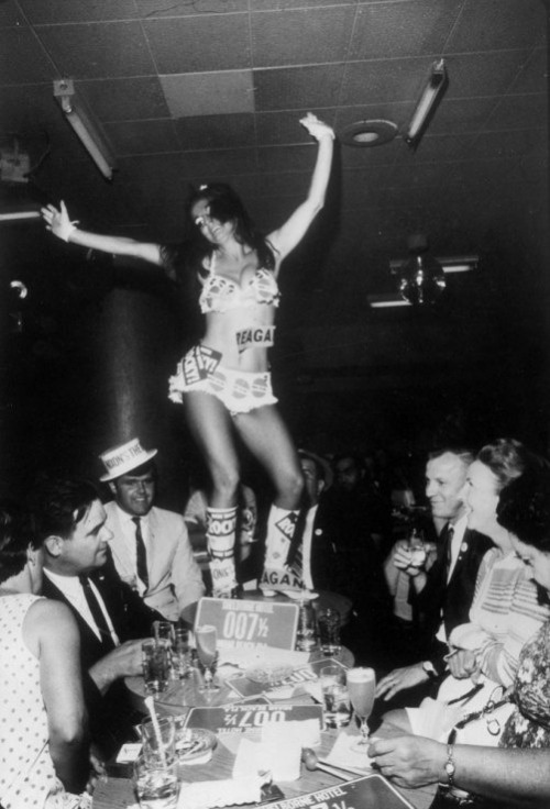 Go-go girl and delegates during the 1968 Republican National Convention, Miami Beach, Florida.
See more photos here.