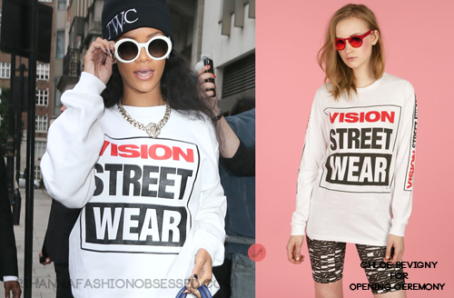 
Rihanna was spotted leaving her hotel in London wearing a $90.00 Chloe Sevigny for Opening Ceremony Vision VSW Screened Long-Sleeve sweatshirt. Rihanna wore a black sleeveless sweatshirt from the brand about two months ago when she was spotted at JFK airport in New York catching a flight. *Bottoms also by the same brand.
UPDATE: Rihanna is wearing white glasses available online by Kate Spade.  Thank you Sheena from hausofrihanna for the tip!

