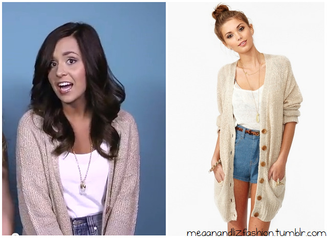 This is the big fluffy beige cardigan that Megan wore in their latest video.
You can buy it here from Nasty Gal for $88