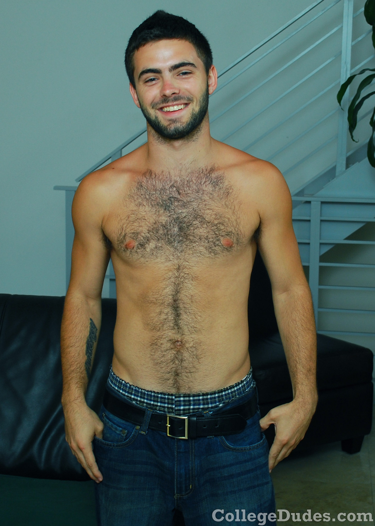 Gay porn star Josh Long strokes his beautiful, untrimmed cock and shows off his hairy butt.