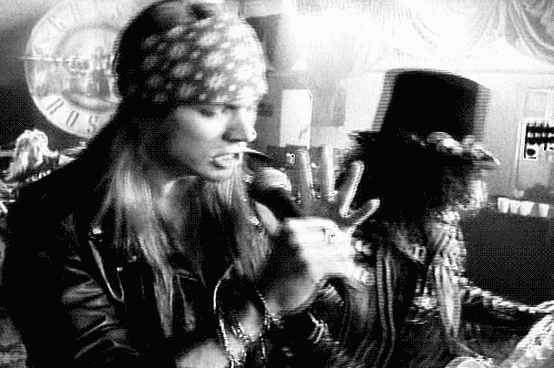 
3. Find a photo of your favourite band and show off the merchandise/albums you have of theirs.

Guns N’ Roses. I have one poster, one vest top, and two albums. If I wasn’t so poor, I’d buy Axl and have him in my room. 