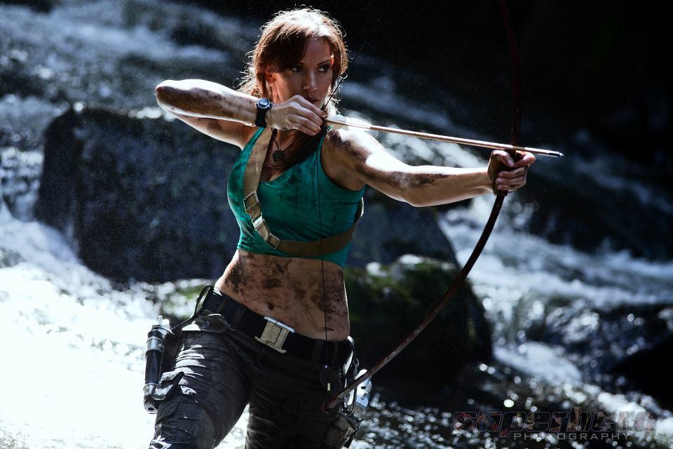 An actress dressed-up as Lara Croft from Tomb Raider poses 