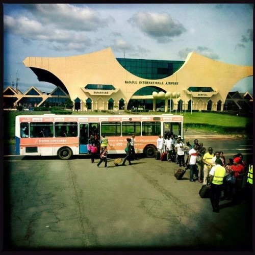 Passengers board a plane in Bajul, Gambia, Aug 12, 2012. Photo by Holly Pickett (Taken with Instagram)