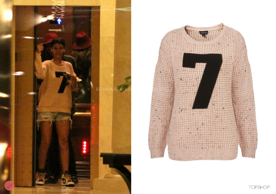 Rihanna spotted at her Los Angeles home looking cute and quite casual wearing a knitted 7 motif jumper from one of her favourite UK high street brand Topshop, available for $76.00. This was worn with a pair of distressed cut off denim jeans and a pair of Nike air Jordans. 