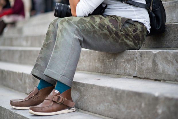 Camouflage faded prints on grey trousers