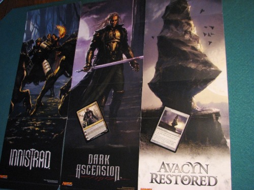 Magic: the Gathering - Fat Pack box wrapper art from Innistrad, Dark Ascension, and Avacyn Restored.
Need your help to fill in the blank here :
• Innistrad poster illustrated by Karl Kopinski / corresponding card ???
• Dark Ascension poster illustratedby Karl Kopinski / corresponding card Sorin, Lord of Innistrad (by Michael Komarck)
• Avacyn Restored poster illustratedby Jaim Jones / corresponding card Helvault (also by Jaime Jones)
UPDATE - It may be Champion of the Parish featured in the first Innistrad FPat poster.