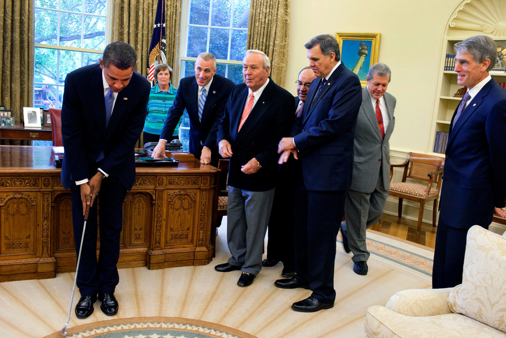 President Barack Obama takes a practice putt with a golf club presented to him by golf legend Arnold Palmer prior to the signing ceremony for H.R. 1243, the Arnold Palmer Congressional Gold Medal Act, in the Oval Office, Sept. 30, 2009. (Official White House photo by Samantha Appleton)


Most iconic Pete Souza photos of Obama family’s first 4 years in the White House  


