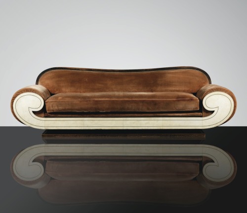 Sotheby&#8217;s 20th Century Design sale today includes this sultry caramel velvet canapé from circa 1925. It is stained wood, vellum and brass. The designer is unknown. The estimate: 20,000 - 30,000€. This statement piece needs space to be seen!
