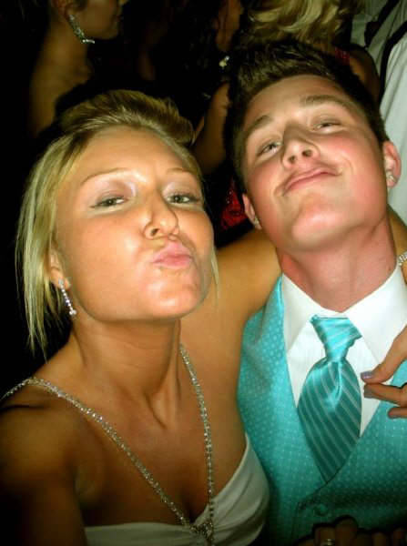 which is worse:  his teal tie and vest, or the double duckface?