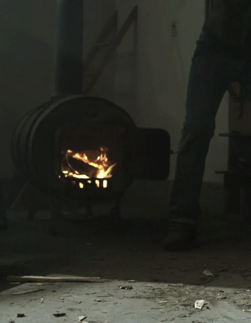 An animated gif of a slow motion fire in a barrel stove.