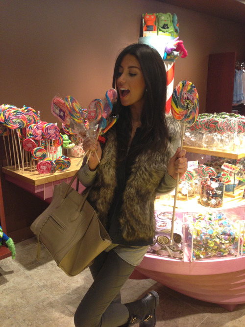 caligurls25: Having some fun at the candy shop. Fur vest from Rebecca TaylorSweater from boutique in LAPants from Helmut LangBoots by Jimmy ChooBag by Celine 