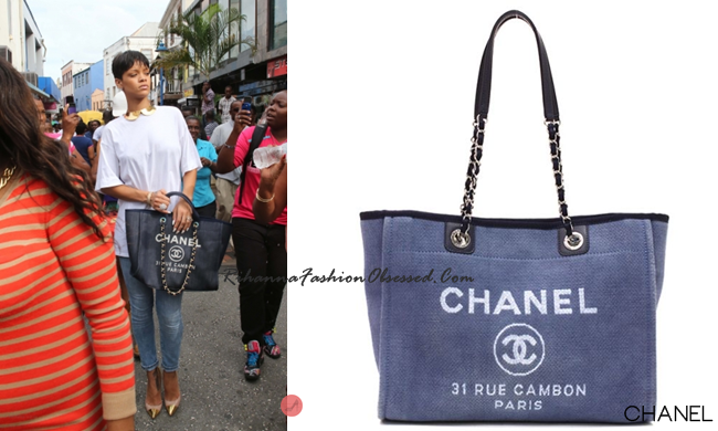 Rihanna was spotted shopping her native hometown of Bridgetown, Barbados with her aunt, Marcel carrying a sold out blue Chanel canvas Cabas Ete tote handbag.
She is also wearing blue skinny jeans by designer Vivienne Westwood for Lee denim along with pinkChristian Louboutin heels with a Marc Jacobs for Louis Vuitton sleek neck piece from his Fall 2011 collection.

Rihanna confirmed on our Instagram post that she is wearing a Rihanna for River Island T-shirt.