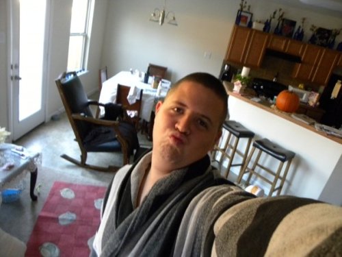 that bathrobe. that duckface. that rocking chair. the lace doily on the coffee table. this picture positively screams &#8220;ladies, i am a sophisticated man with sophisticated tastes. please, come to my home and watch television with me while we drink this boxed wine my parents left in the fridge when they went out of town for the weekend.&#8221; 