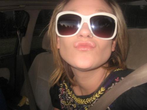 sunglasses in the dark while making duckface in the car. yep. there are so many cliches in these pictures that we should draw up duckface bingo cards or something.