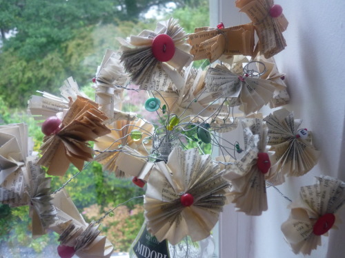 I love making paper flowers out of old book pages, these are the ones I made for my mum the Mother’s day before last and they’re still sat in the hallway =] Commercially brought flowers often seem like an odd gesture to me, very sweet, but symbolically terrible.  Shop brought flowers wither and end up looking a bit sad, not to mention the environmental issues with buying farmed flowers.  Handmade ones are much more unique and thoughtful!<br /