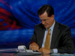 gif of Stephen Colbert using a calculator